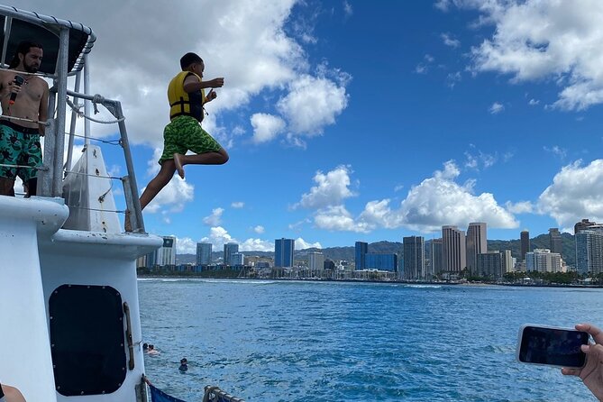 Oahu 5-in-1 Deluxe Cruise: Turtle Snorkeling & Ocean Activities - Kayaks and paddleboards near the boat