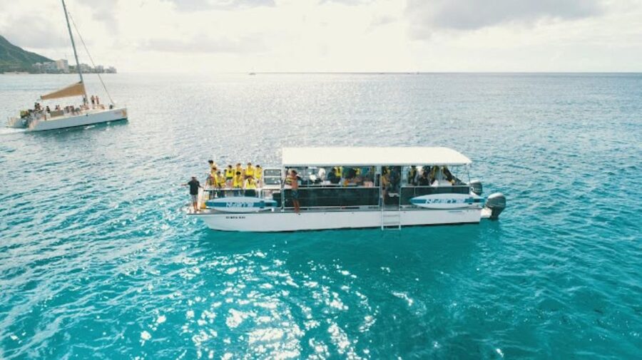 Oahu Snorkeling with Turtles, Water Scooter, Paddleboard - A catamaran ride with Waikiki pickup